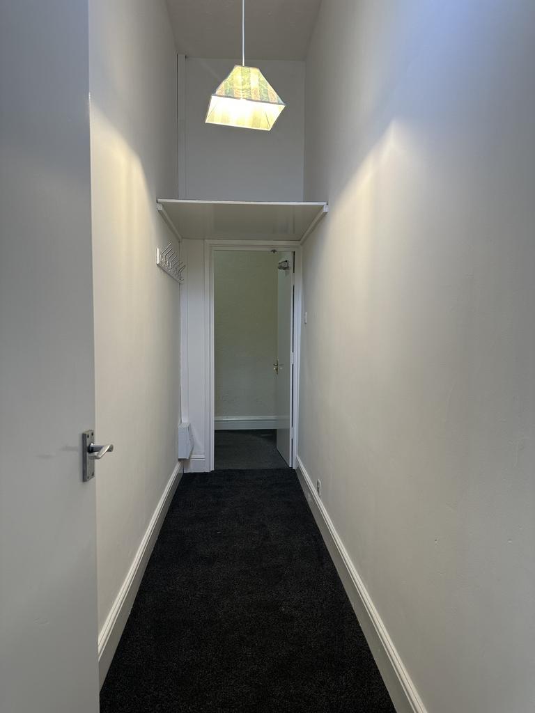 A clean and tidy hallway with good natural ligh...