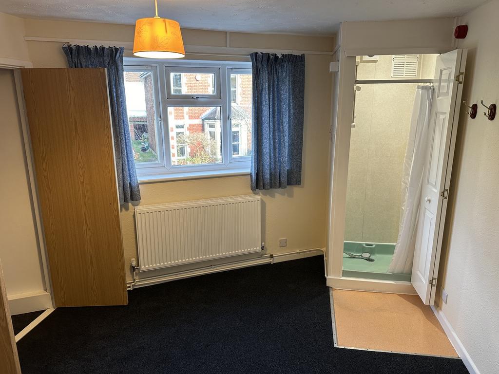 A spacious double bedroom featuring good natura...