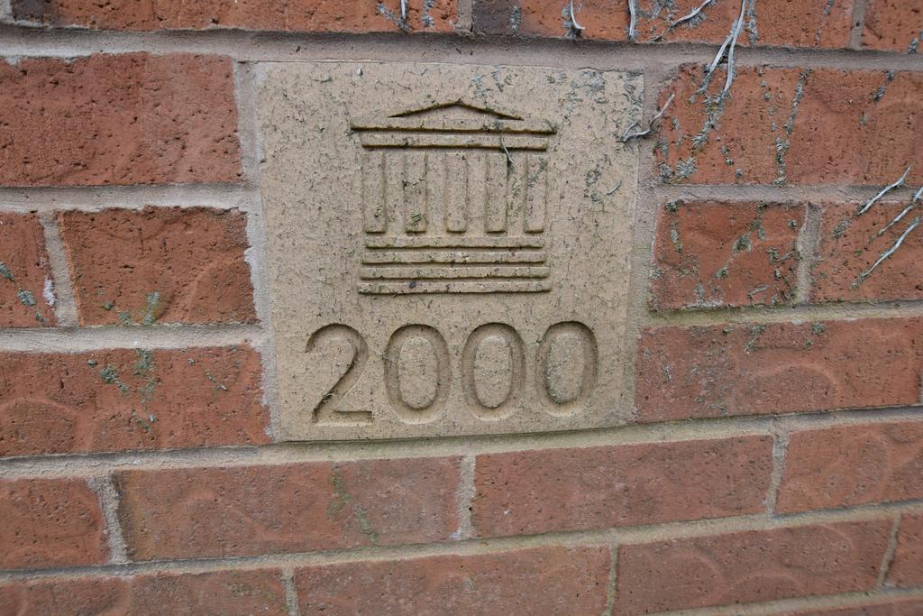 Plaque on front wall