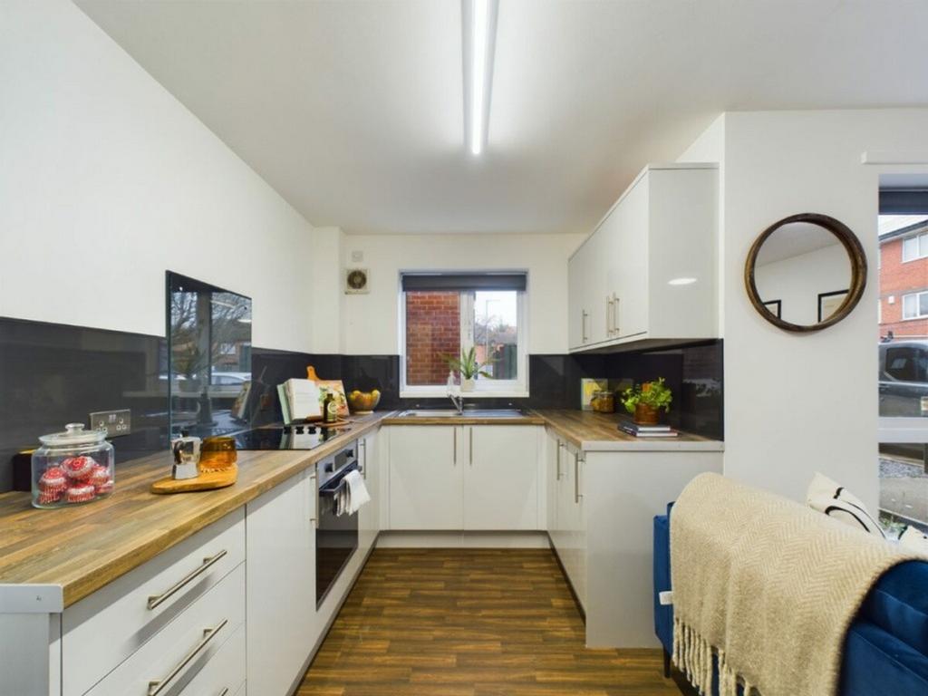 A bright and modern kitchen with ample counter ...