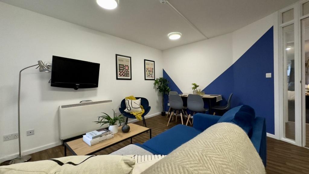 A spacious and stylish modern living room, perf...