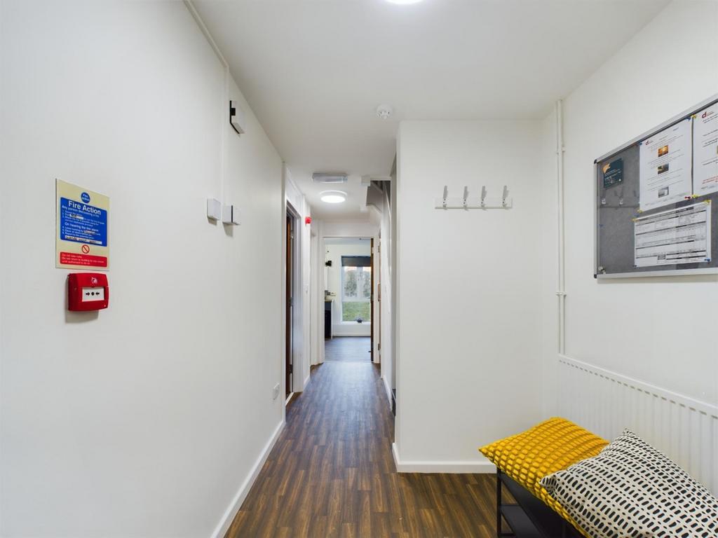 A bright and tidy hallway featuring modern deco...