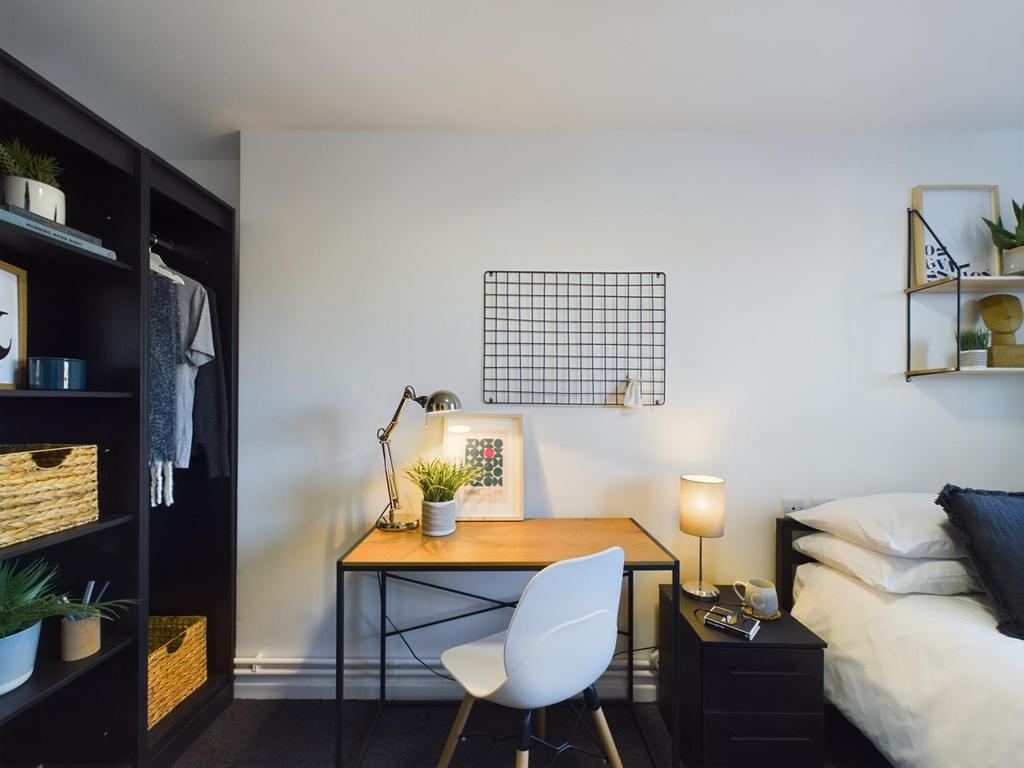 A stylish and well-organized double bedroom fea...