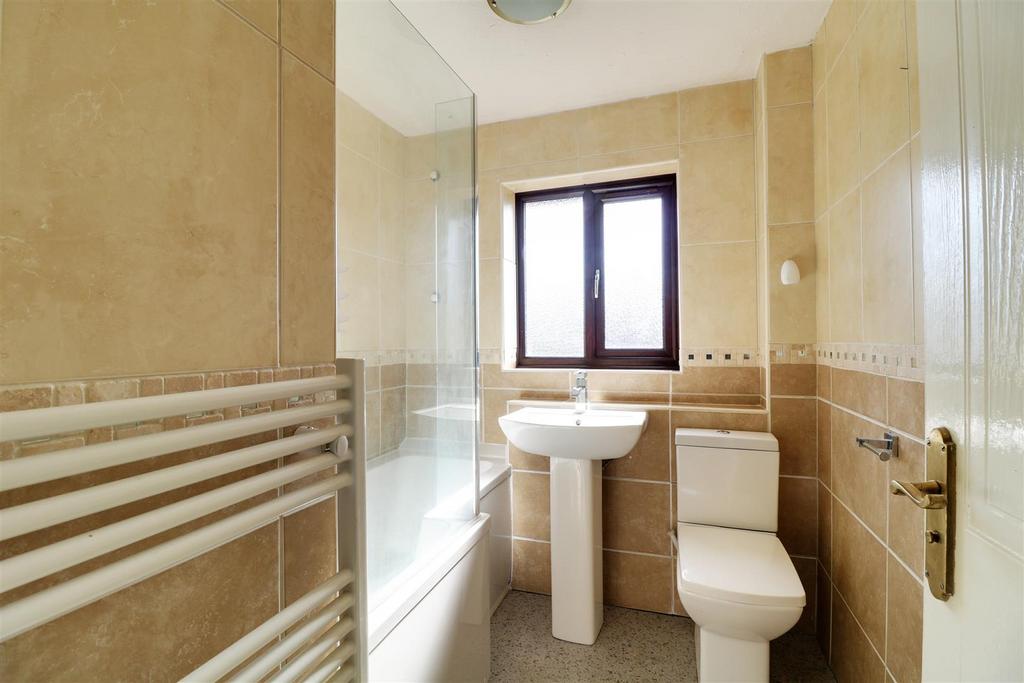 Fully tiled family bathroom/wc