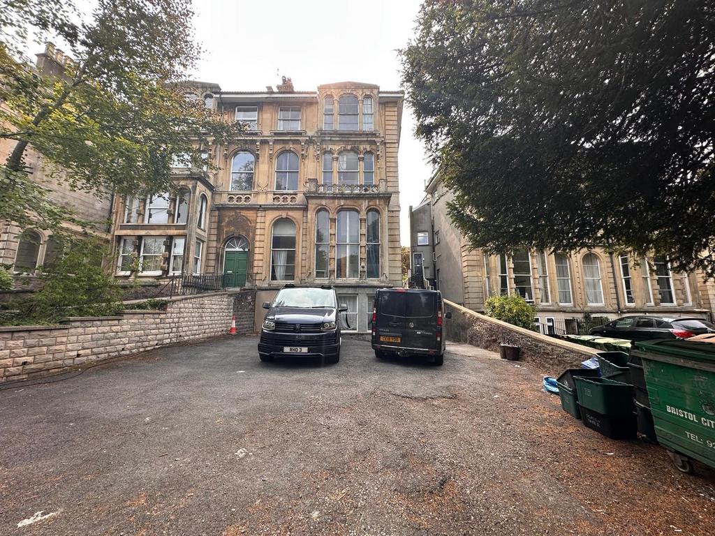 Elegant period building with arched windows and...