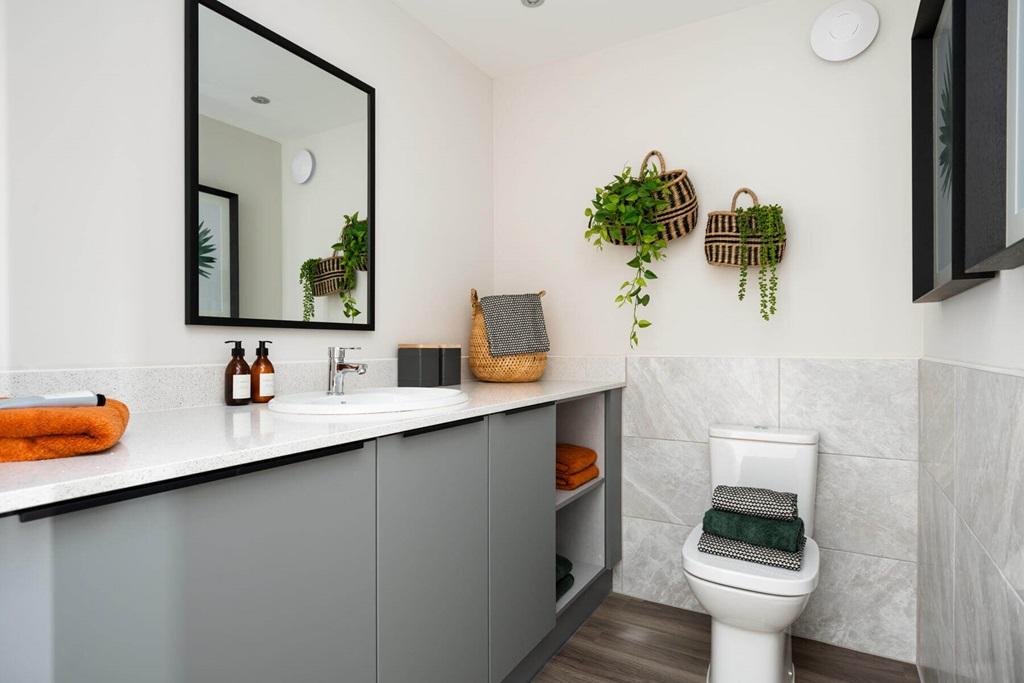 A guest cloakroom also hosts space for laundry...