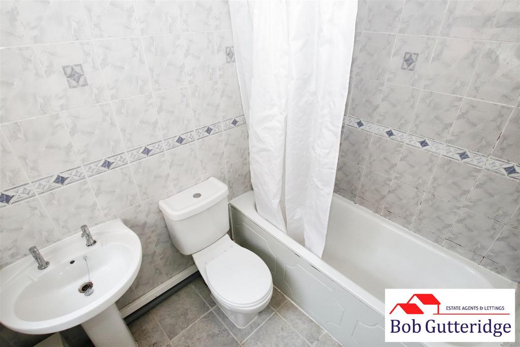 Fully tiled ground floor bathroom