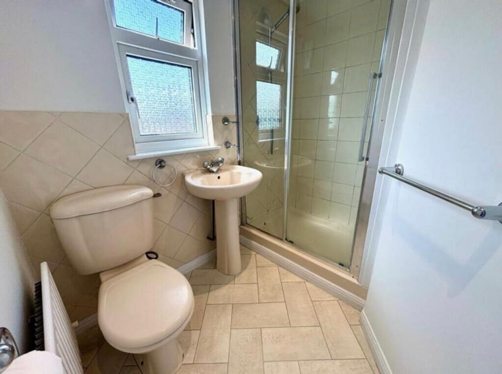 A bright and clean bathroom featuring a modern ...