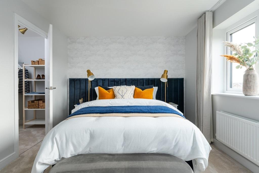 The main bedroom is complete with a walk-in...