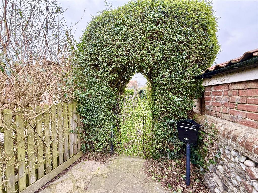Archway and gate from driveway