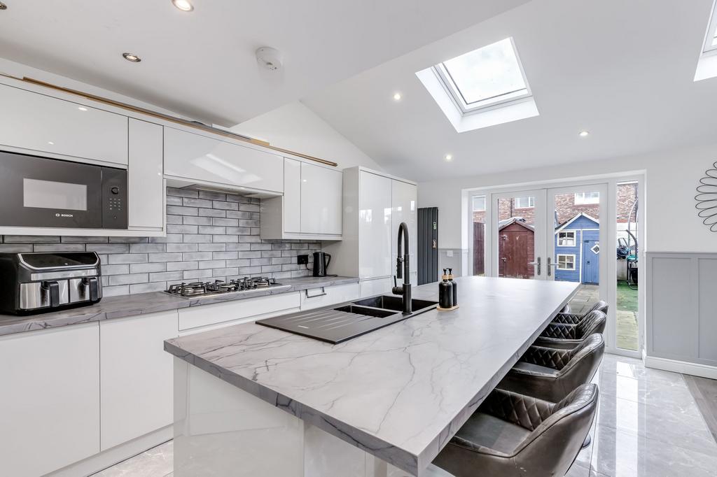 Open plan kitchen diner with seating area