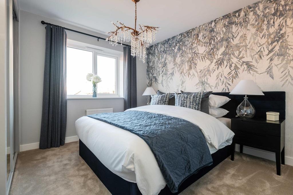 The king-size main bedroom has ample space for...