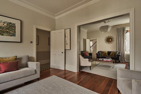 34 Bernard Gardens, London, SW19 7BE