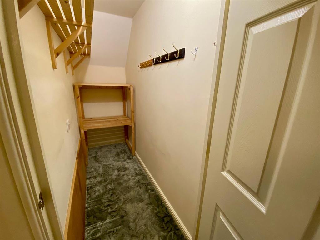 Store cupboard off entrance hall.jpg