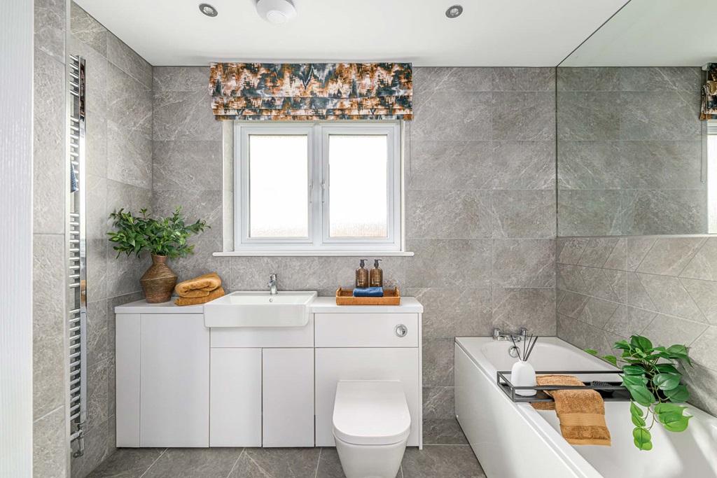 Family bathroom with bath and shower