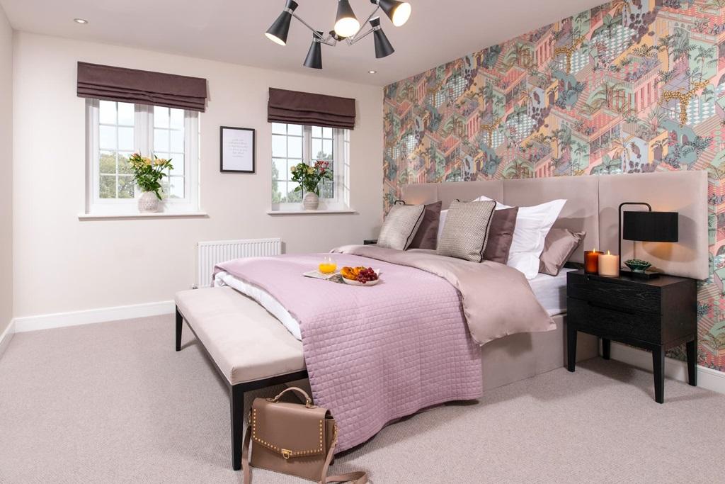 Large, double sized main bedroom looks out to...