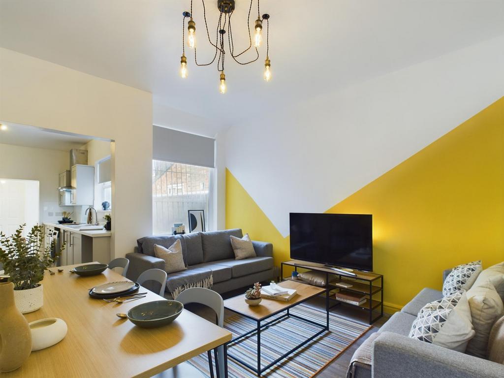 A spacious and stylish modern living room perfe...