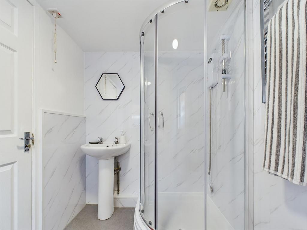 A modern and stylish bathroom featuring a sleek...
