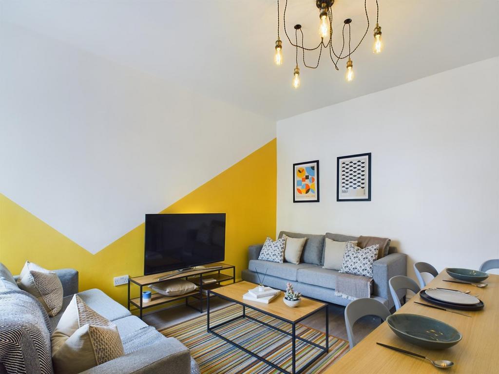 A bright and inviting large modern living room,...