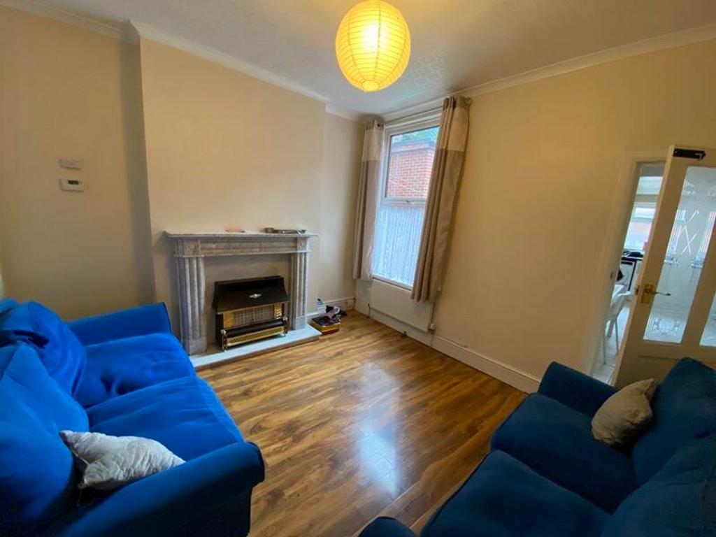 A bright and inviting living room featuring com...
