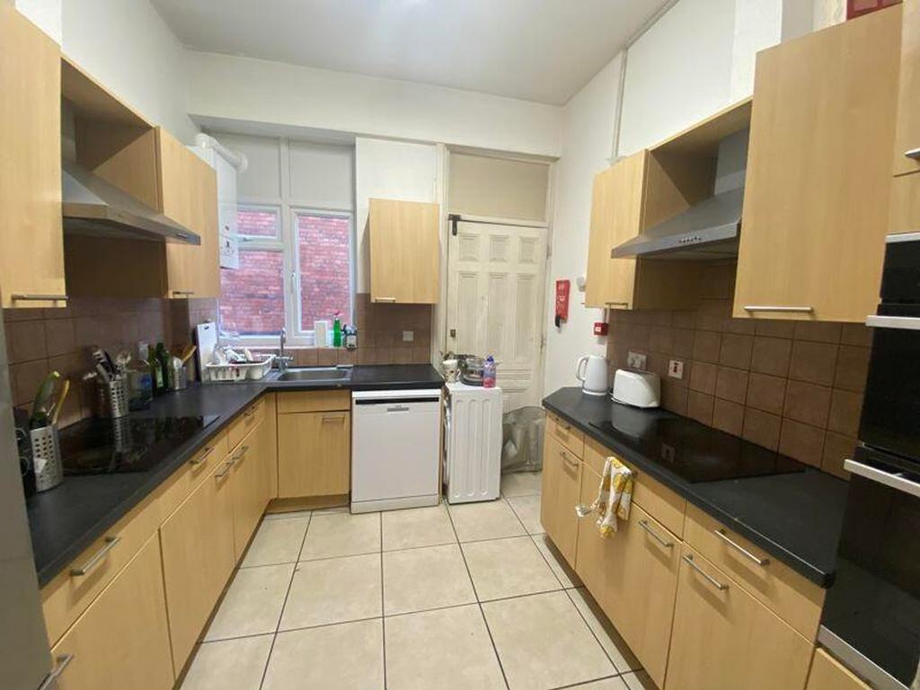 A spacious and well-lit kitchen, perfect for pr...