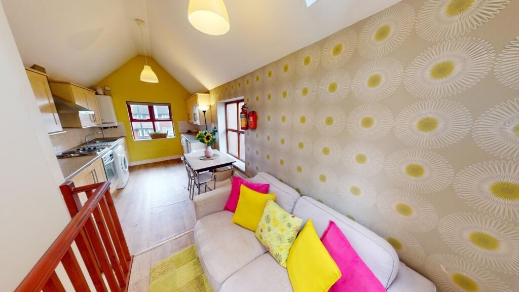 Bright and cozy living room with contemporary d...