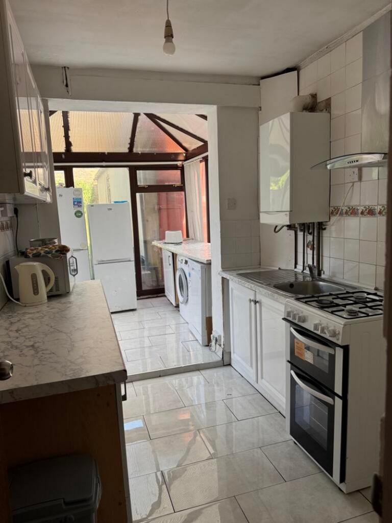 A bright and tidy kitchenette featuring modern ...