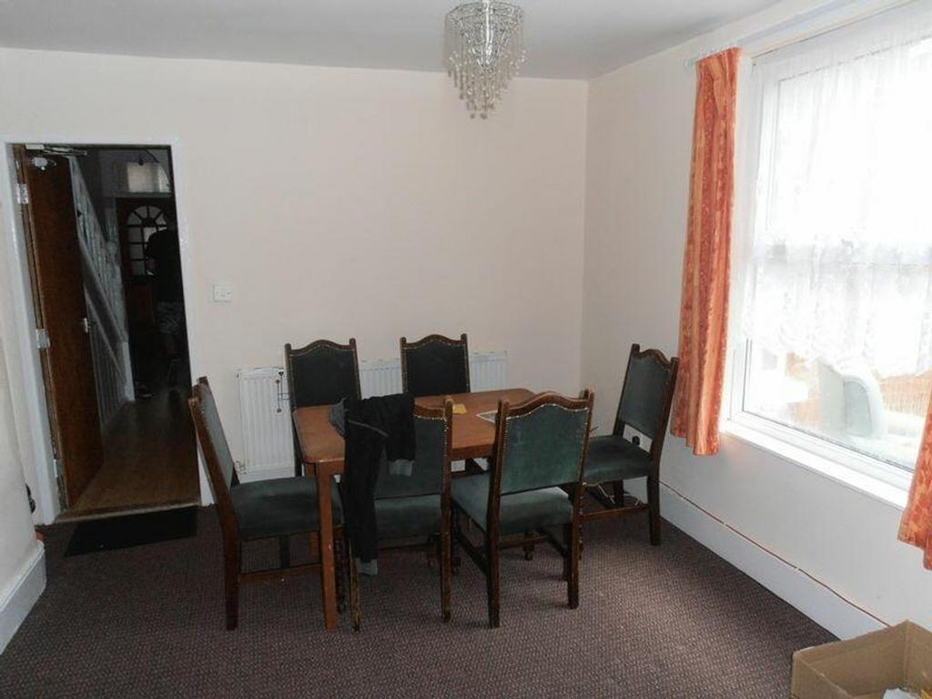 A spacious and inviting living room, perfect fo...