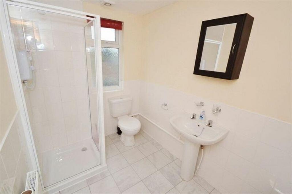 A clean and bright bathroom featuring a modern ...