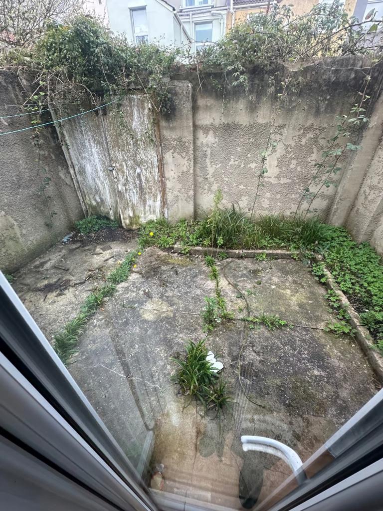 A spacious garden area with potential for outdo...
