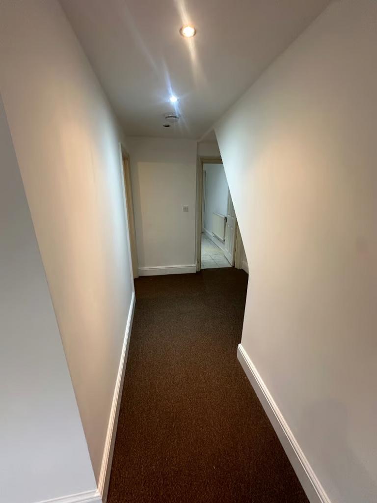 A clean and well-maintained hallway with adequa...