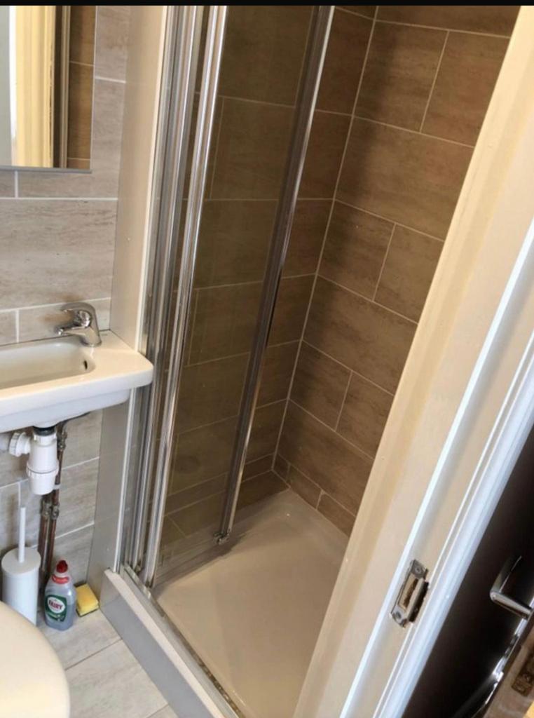 A clean and modern bathroom featuring a spaciou...