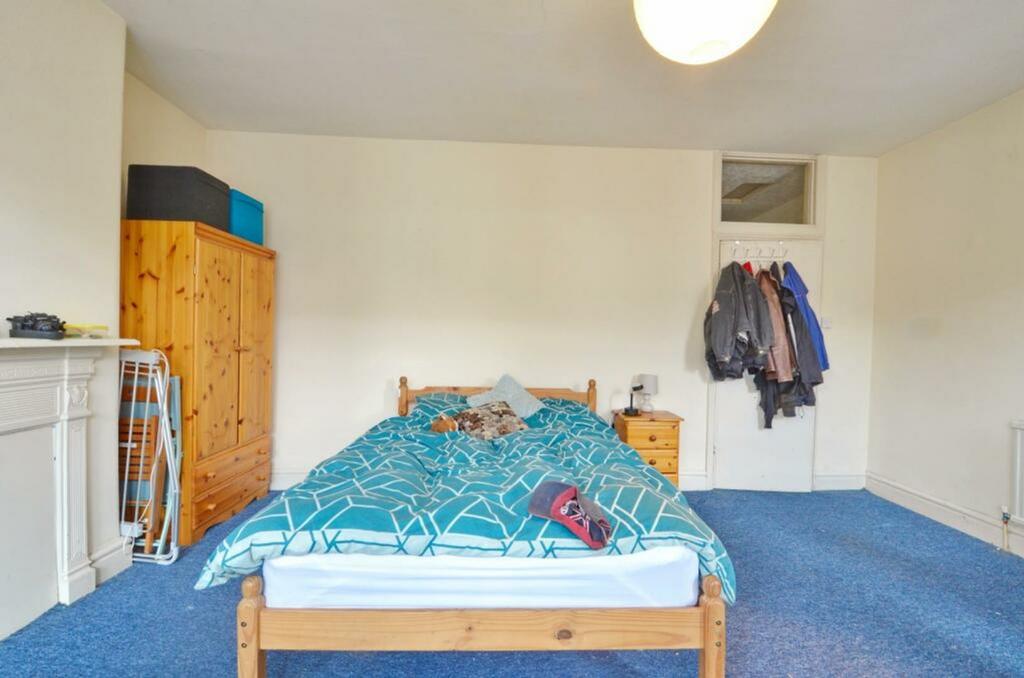 A spacious and inviting double bedroom with amp...