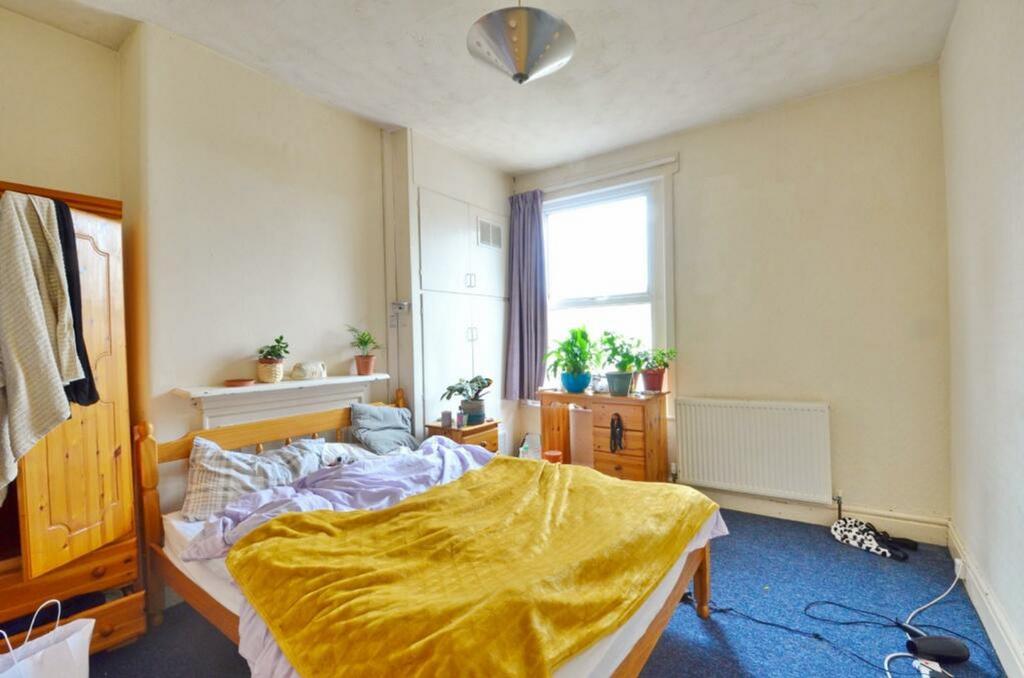 A cozy double bedroom filled with natural light...
