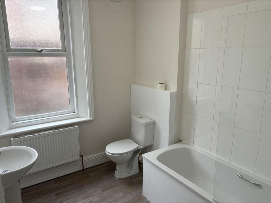A bright and tidy bathroom with modern fixtures...