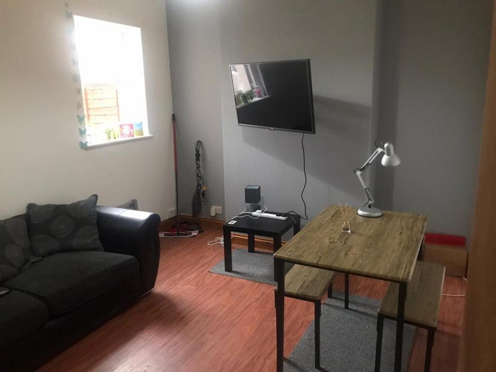A cozy living room featuring a comfortable sofa...