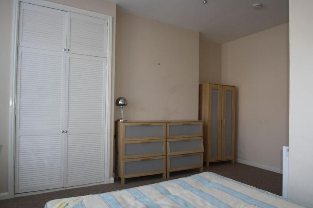 Spacious double bedroom featuring natural light...