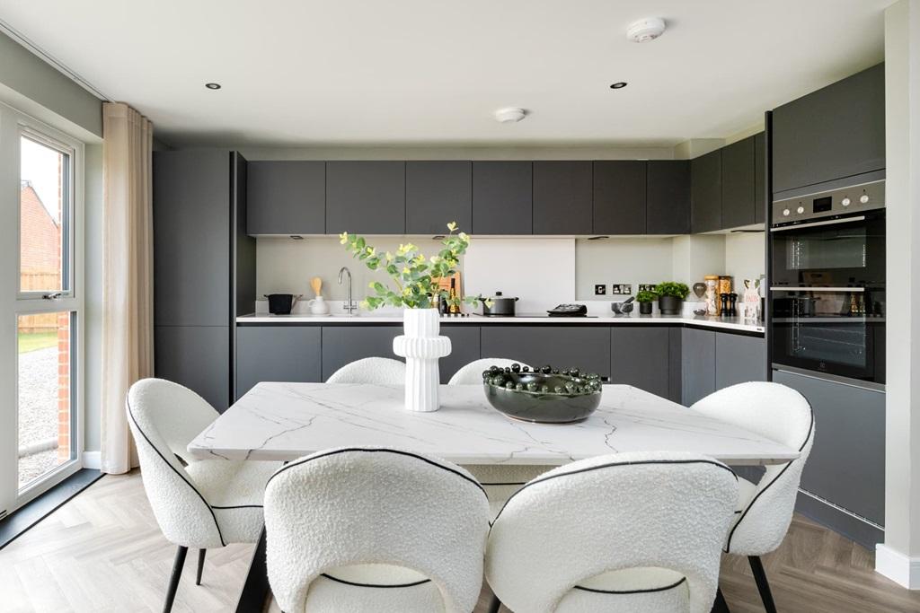 A modern kitchen and dining area with ample...