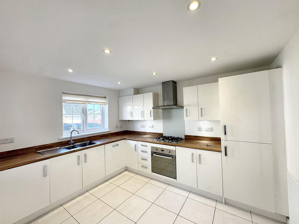 White kitchen with integrated appliances
