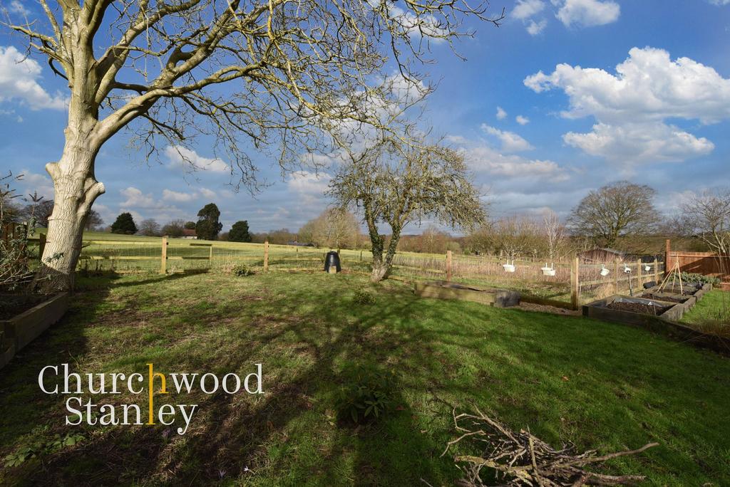 Rear garden and farmland beyond