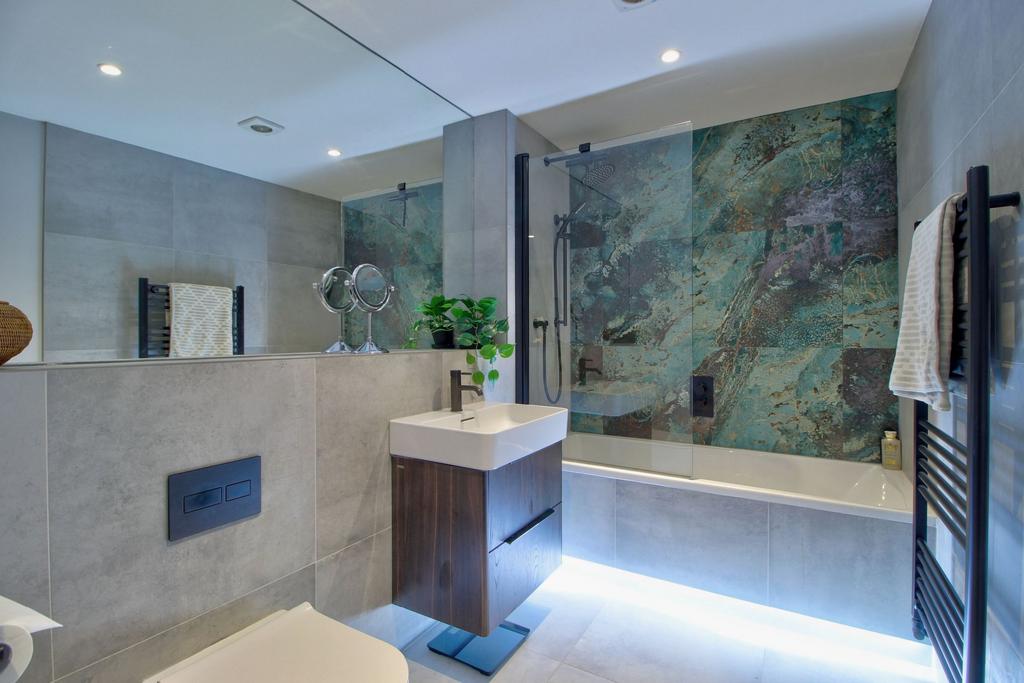Family bathroom with 'floating' bath