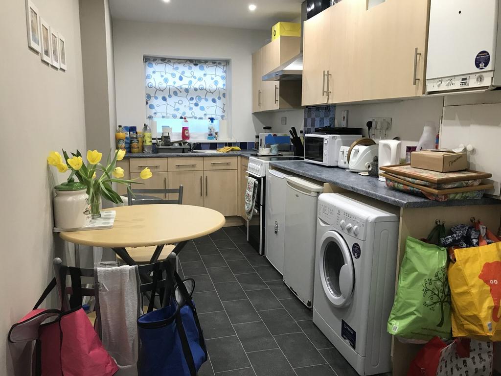 A tidy and functional kitchenette with modern a...