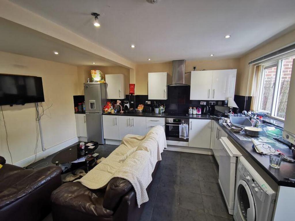 A spacious kitchen with modern appliances, perf...