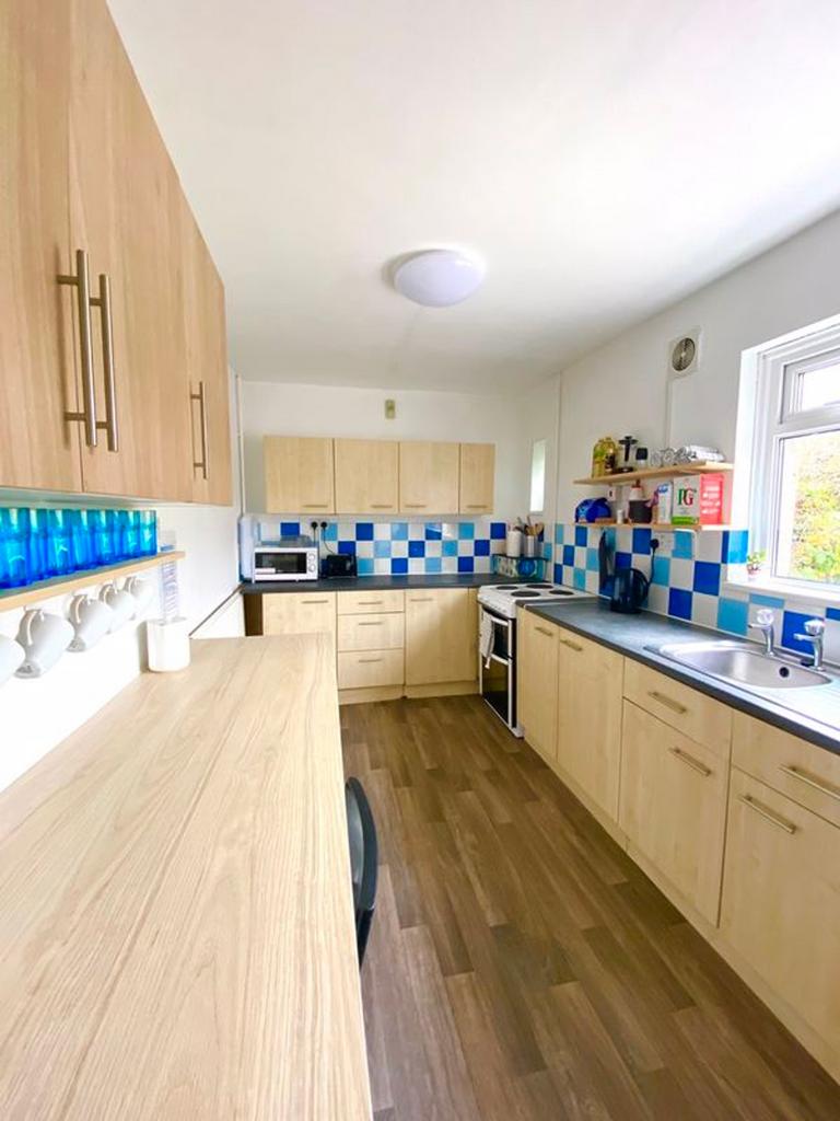 A bright and modern kitchenette featuring ample...