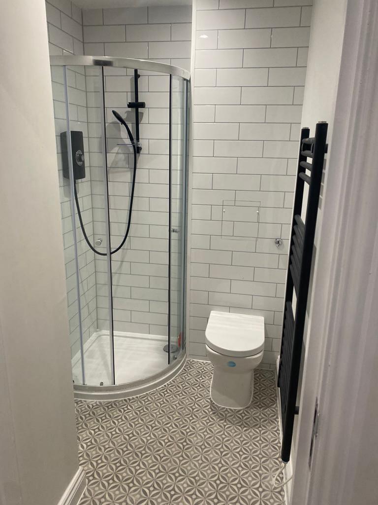 A modern and stylish bathroom featuring a sleek...