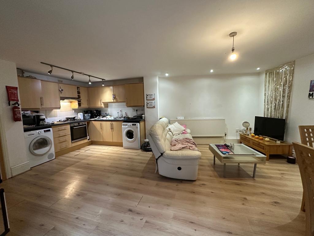 A spacious and modern living room with an open ...
