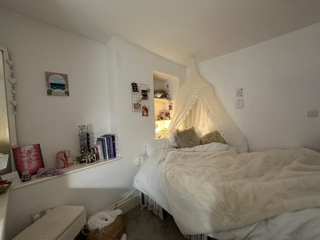 A cozy and inviting double bedroom with charmin...