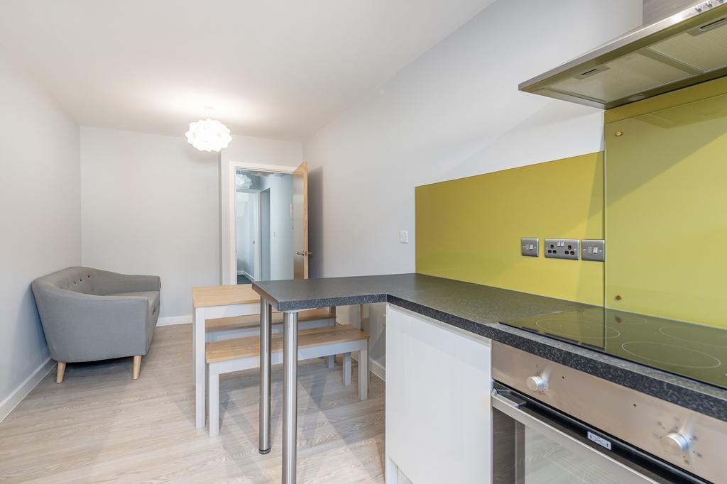 Modern kitchen featuring sleek design with ampl...