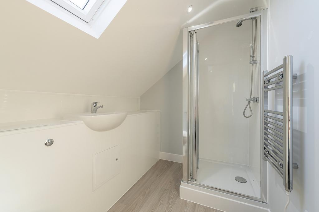 Modern bathroom featuring a sleek shower, styli...
