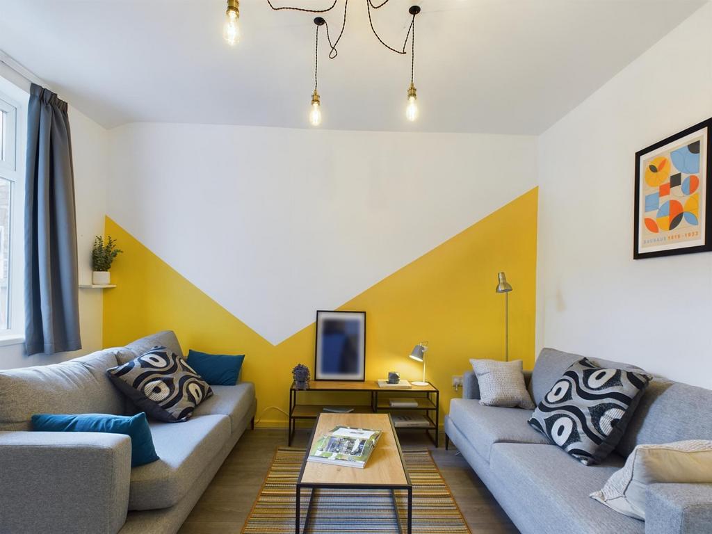 A stylish and spacious modern living room, perf...
